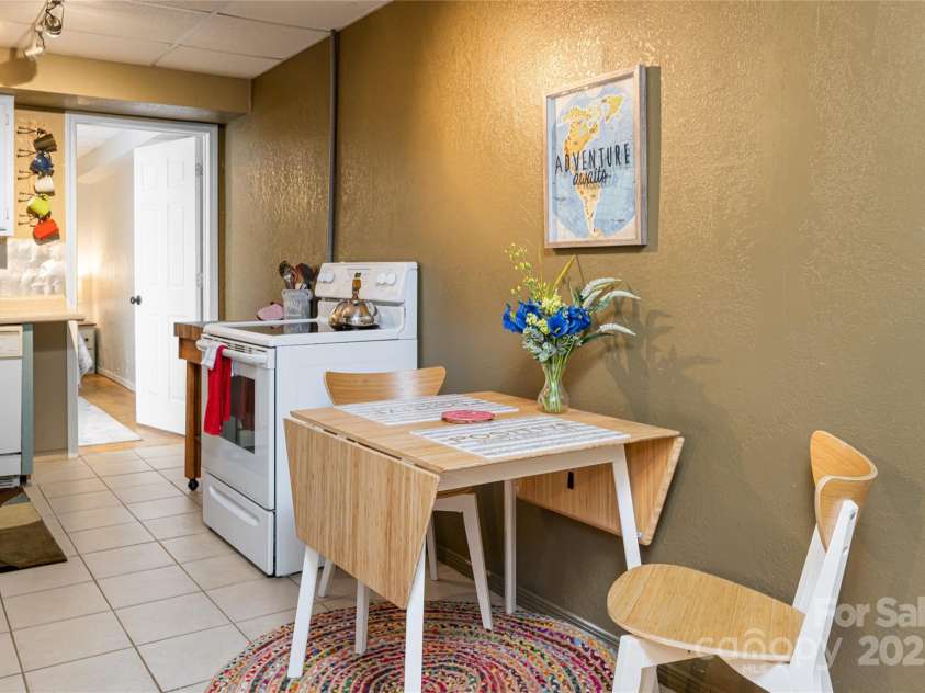 39 Kirkland Drive, Asheville, NC 28805.  MLS# CAR4325951, YatesRealty ID 11024. Basement kitchen and breakfast nook