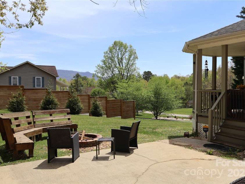 39 Kirkland Drive, Asheville, NC 28805.  MLS# CAR4325951, YatesRealty ID 11024. Camp fire area with mountain views, just off the veranda