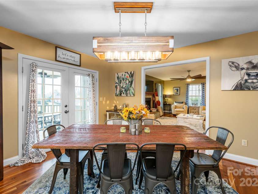 39 Kirkland Drive, Asheville, NC 28805.  MLS# CAR4325951, YatesRealty ID 11024. Main-level dining room with french doors to the veranda