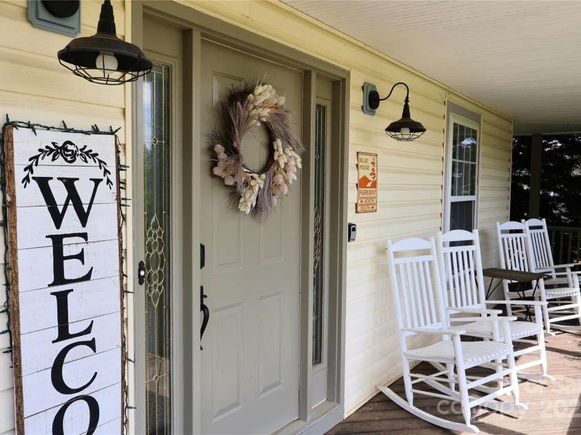 39 Kirkland Drive, Asheville, NC 28805.  MLS# CAR4325951, YatesRealty ID 11024. Rocking chair front porch 