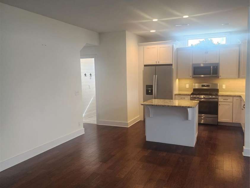 62 River Bend Lane, Fletcher, NC 28732.  MLS# CAR4335213, YatesRealty ID 11041. Kitchen towards laundry-garage
