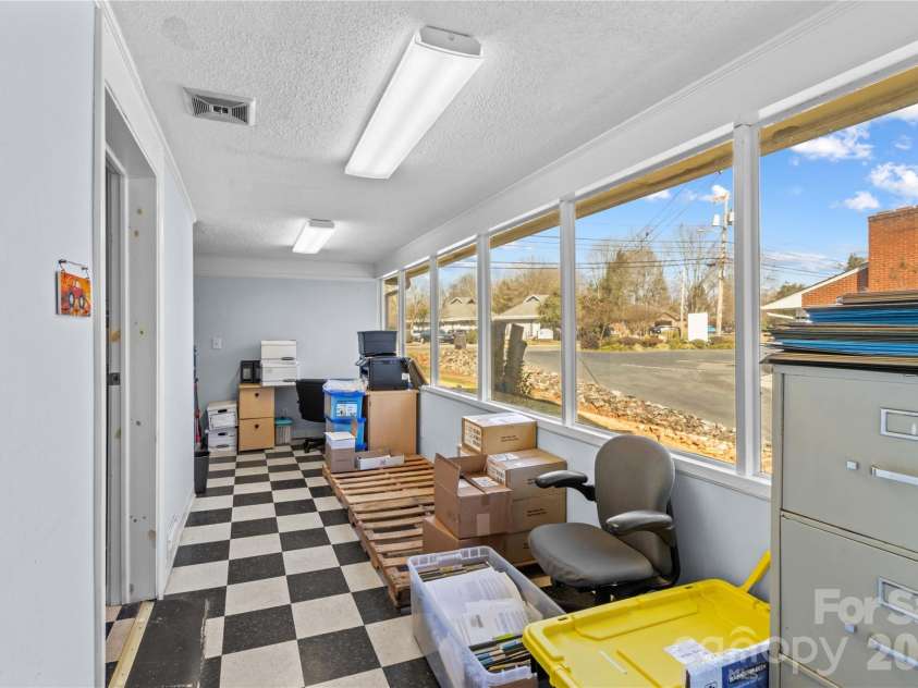 1120 Davie Avenue, Statesville, NC 28677.  MLS# CAR4326413, YatesRealty ID 11044. Sunroom off Livingroom
