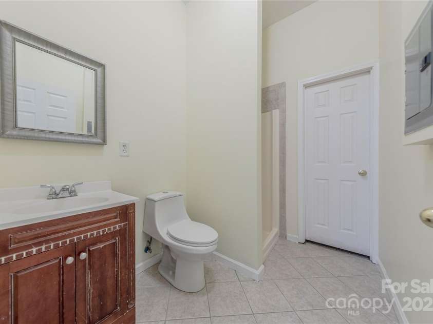 4225 Nathaniel Glen Court, Matthews, NC 28105.  MLS# CAR4213863, YatesRealty ID 11050. Basement Full Bathroom