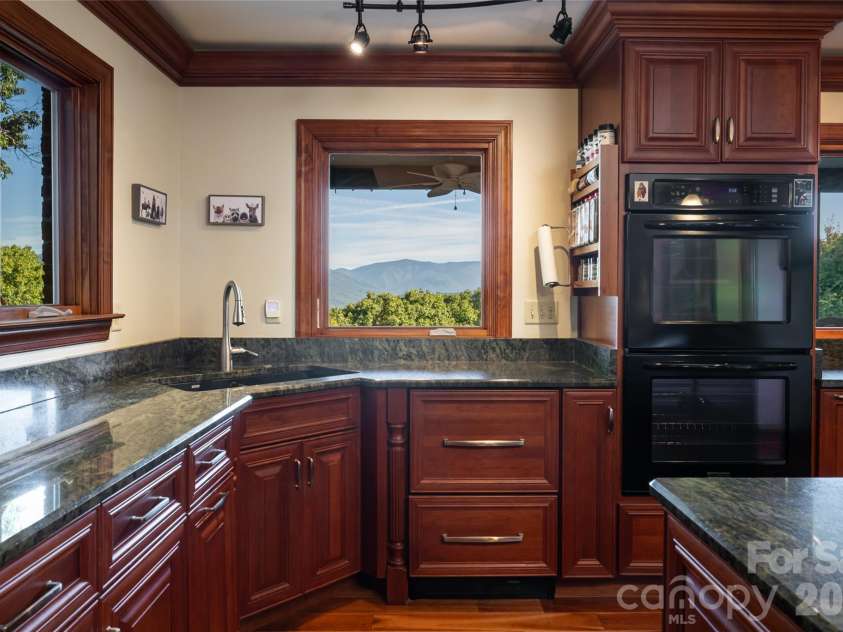 126 Wildflower Cove Drive, Swannanoa, NC 28778.  MLS# CAR4427361, YatesRealty ID 11052. Magnificent views from the kitchen