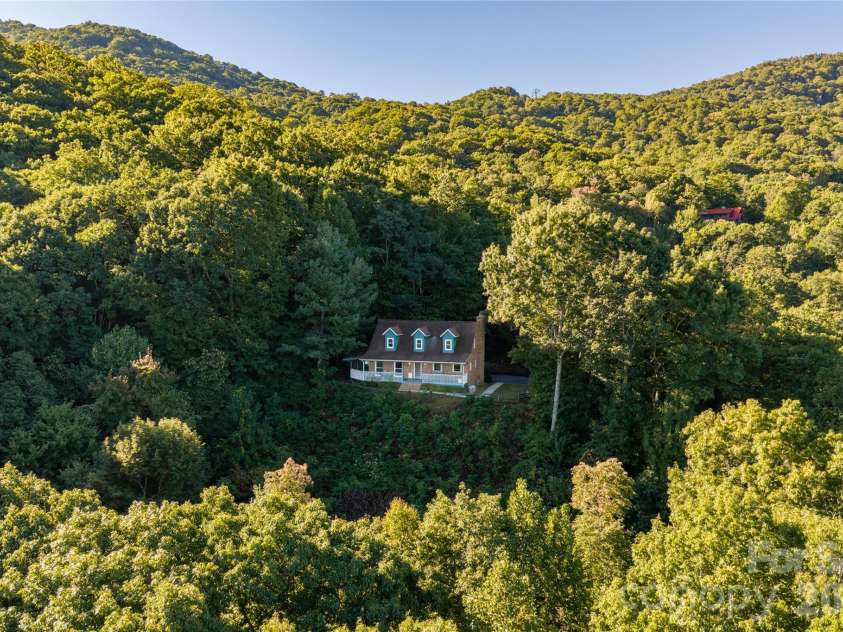 126 Wildflower Cove Drive, Swannanoa, NC 28778.  MLS# CAR4427361, YatesRealty ID 11052. Private and serene mountainside setting