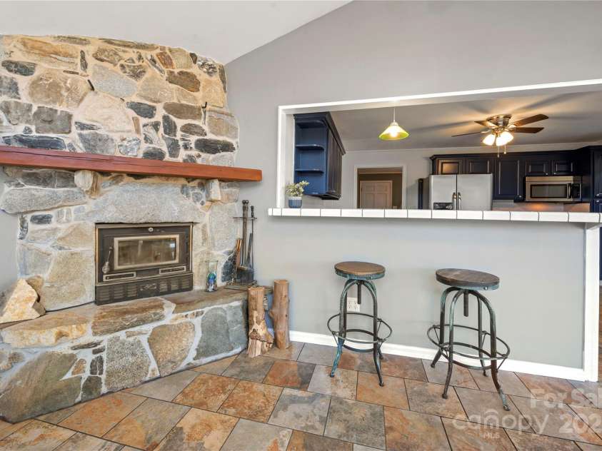 513 Paradise Circle, Belmont, NC 28012.  MLS# CAR4219509, YatesRealty ID 11053. Fireplace with wood burning insert