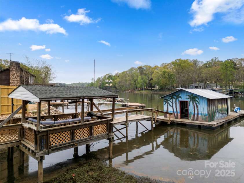 513 Paradise Circle, Belmont, NC 28012.  MLS# CAR4219509, YatesRealty ID 11053. Large, grandfathered dock with fixed pier, floating boat house and floating sun deck