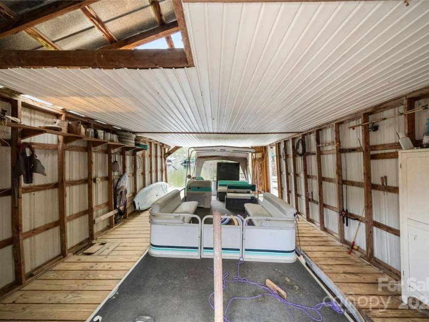 513 Paradise Circle, Belmont, NC 28012.  MLS# CAR4219509, YatesRealty ID 11053. View inside the boathouse