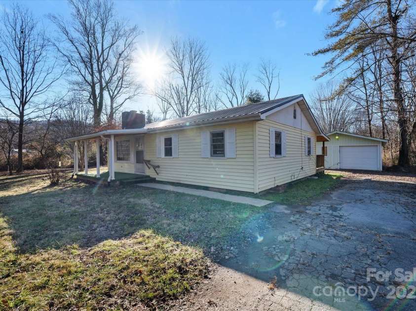 4 Morgan Cove Road, Candler, NC 28715.  MLS# CAR3898041, YatesRealty ID 11057. Detached garage just to the side and behind the house leaving plenty of space for parking in the driveway.