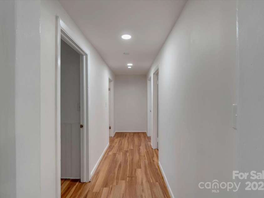 4 Morgan Cove Road, Candler, NC 28715.  MLS# CAR3898041, YatesRealty ID 11057. Hallway to bath and bedrooms.