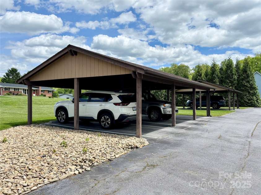 17 Moland Drive, Etowah, NC 28729.  MLS# CAR4255576, YatesRealty ID 11062. Detached carport