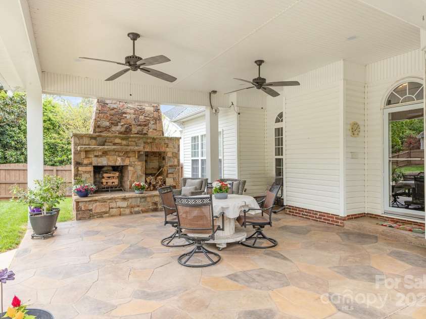 212 Horn Tassel Court, Indian Trail, NC 28079.  MLS# CAR4244678, YatesRealty ID 11066. Covered patio with stamped concrete floor is over 500 sq ft.