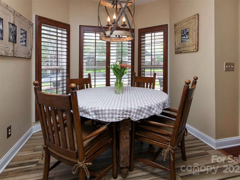 212 Horn Tassel Court, Indian Trail, NC 28079.  MLS# CAR4244678, YatesRealty ID 11066. Eat in area overlooks pool.