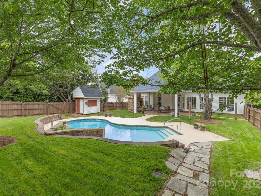 212 Horn Tassel Court, Indian Trail, NC 28079.  MLS# CAR4244678, YatesRealty ID 11066. Every day is a vacation with this resort style backyard!