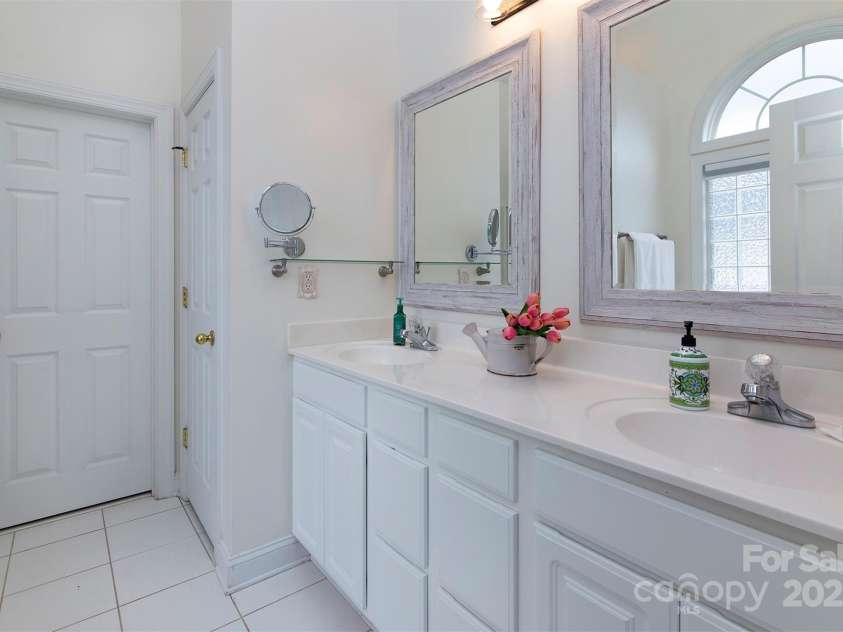 212 Horn Tassel Court, Indian Trail, NC 28079.  MLS# CAR4244678, YatesRealty ID 11066. Primary bathroom has dual sink vanity and lots of light.