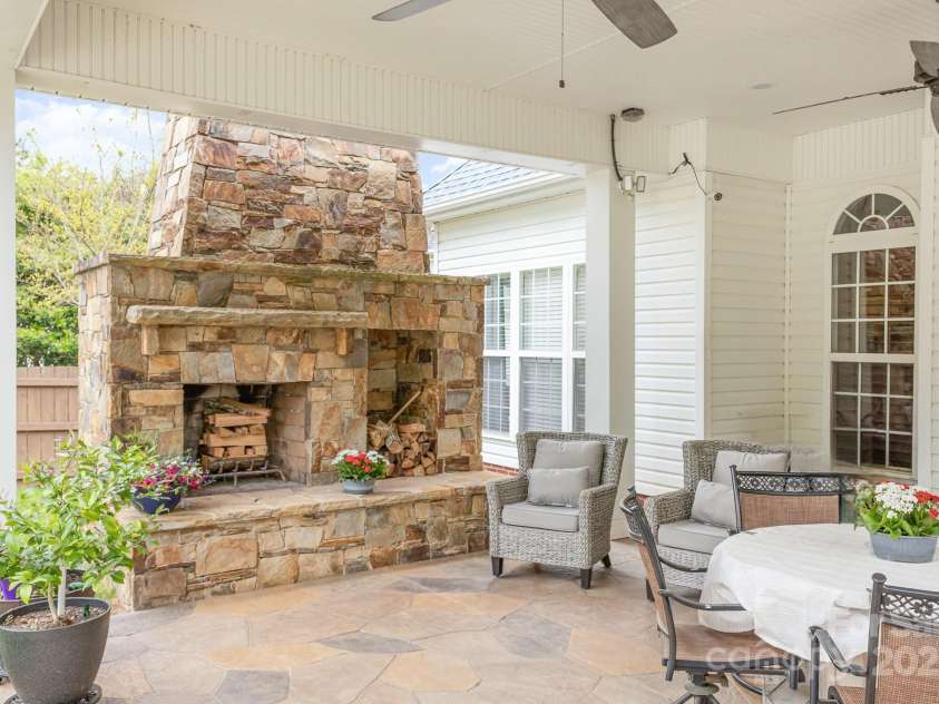 212 Horn Tassel Court, Indian Trail, NC 28079.  MLS# CAR4244678, YatesRealty ID 11066. Stone fireplace is a beautiful focal point and perfect for a chilly night.
