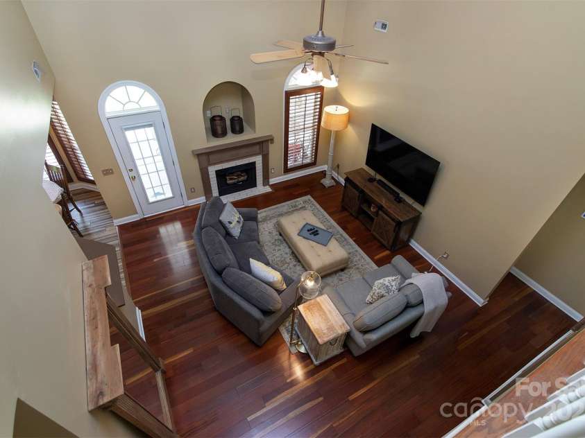 212 Horn Tassel Court, Indian Trail, NC 28079.  MLS# CAR4244678, YatesRealty ID 11066. The 2 story living room is a dramatic feature.