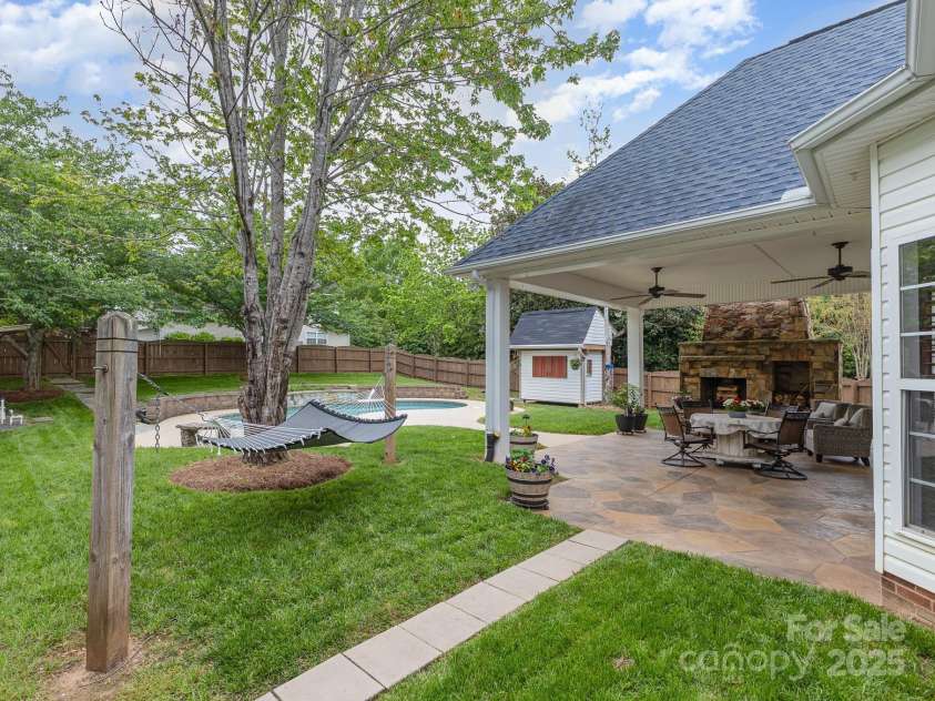 212 Horn Tassel Court, Indian Trail, NC 28079.  MLS# CAR4244678, YatesRealty ID 11066. View of backyard from the outside entry.  Imagine this to greet your guest!
