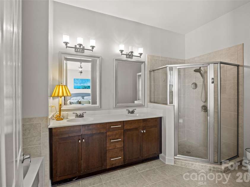 5425 Closeburn Road, Charlotte, NC 28210.  MLS# CAR4366605, YatesRealty ID 11067. Primary bathroom with double vanity, shower and bathtub