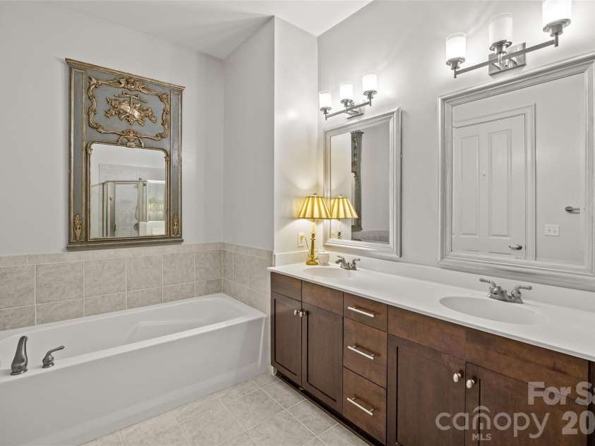 5425 Closeburn Road, Charlotte, NC 28210.  MLS# CAR4366605, YatesRealty ID 11067. Primary bathroom with double vanity, shower and bathtub