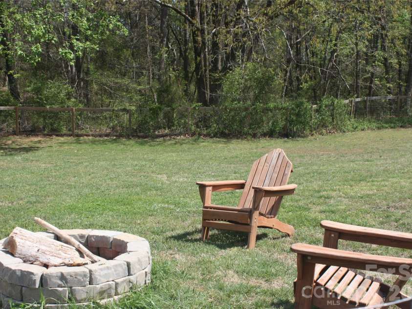191 Celeste Eufola Road, Statesville, NC 28677.  MLS# CAR4365990, YatesRealty ID 11072. Fire pit in side yard