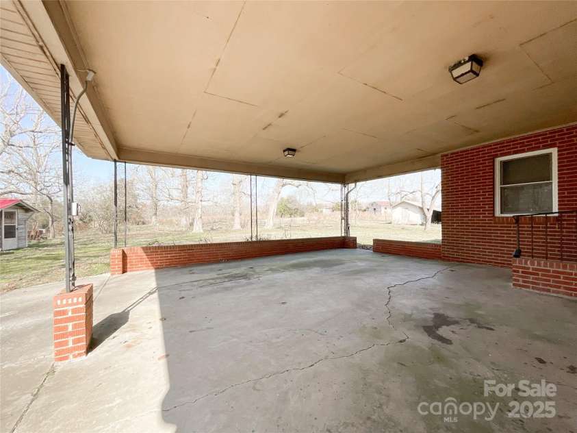 6523 Prospect Road, Monroe, NC 28112.  MLS# CAR4219856, YatesRealty ID 11076. 2 car side load carport