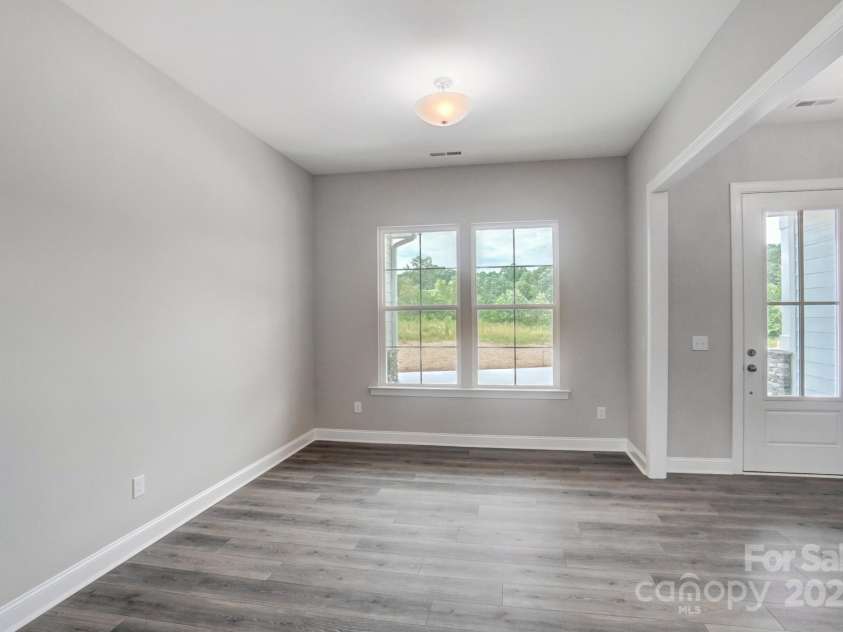 552 Fern Hill Road, Mooresville, NC 28117.  MLS# CAR4188879, YatesRealty ID 11078. Representative Photo-Dining Room Open with columns