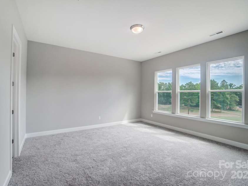 552 Fern Hill Road, Mooresville, NC 28117.  MLS# CAR4188879, YatesRealty ID 11078. Representative Photo-Primary Bedroom. We added a 3' extension off the back of the bedroom. This photo does not show that.