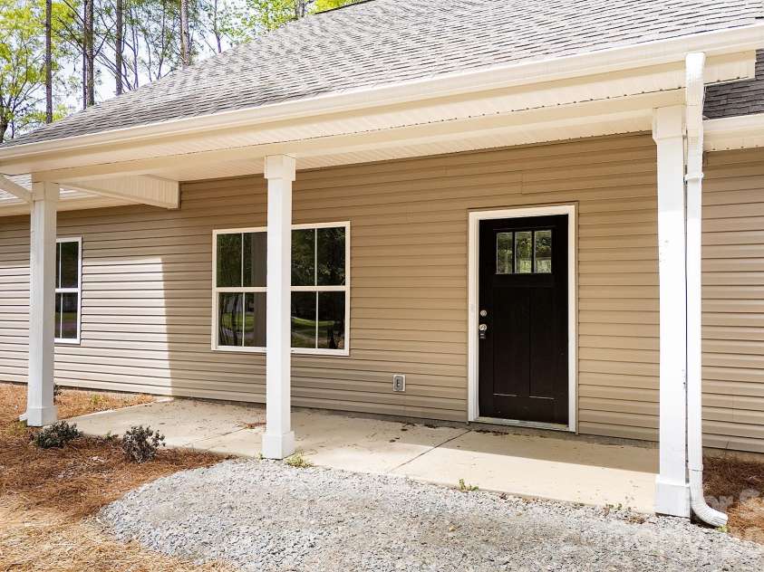 318 Stanback Street, Mount Gilead, NC 27306.  MLS# CAR4239118, YatesRealty ID 11090. Covered front patio.
