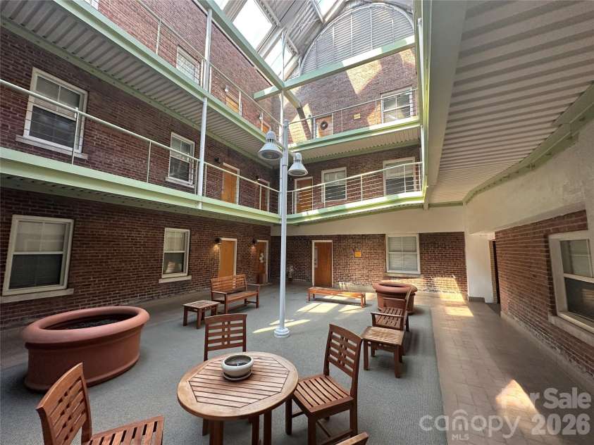 315 Spruce Street, Winston Salem, NC 27101.  MLS# CAR4362792, YatesRealty ID 11096. Third Floor Atrium with seating in the common area