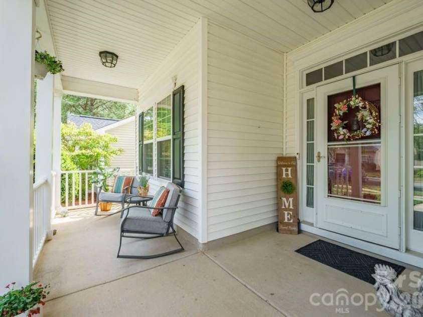 16515 Amberside Road, Cornelius, NC 28031.  MLS# CAR4366674, YatesRealty ID 11103. Covered front porch is large and deep