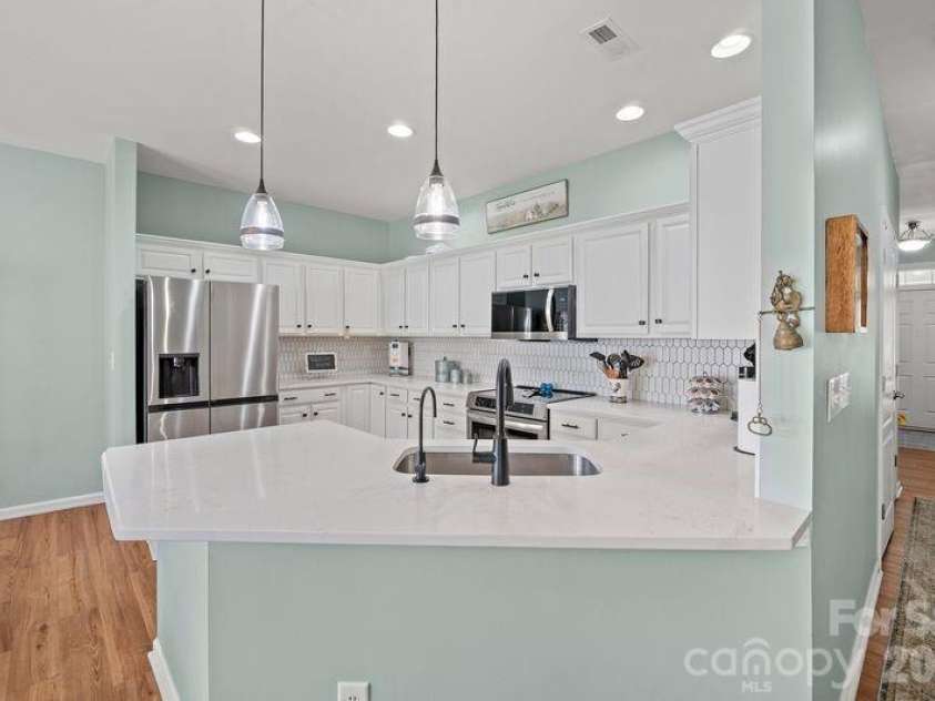 16515 Amberside Road, Cornelius, NC 28031.  MLS# CAR4366674, YatesRealty ID 11103. Deep sink and refrigerator with acceptable offer