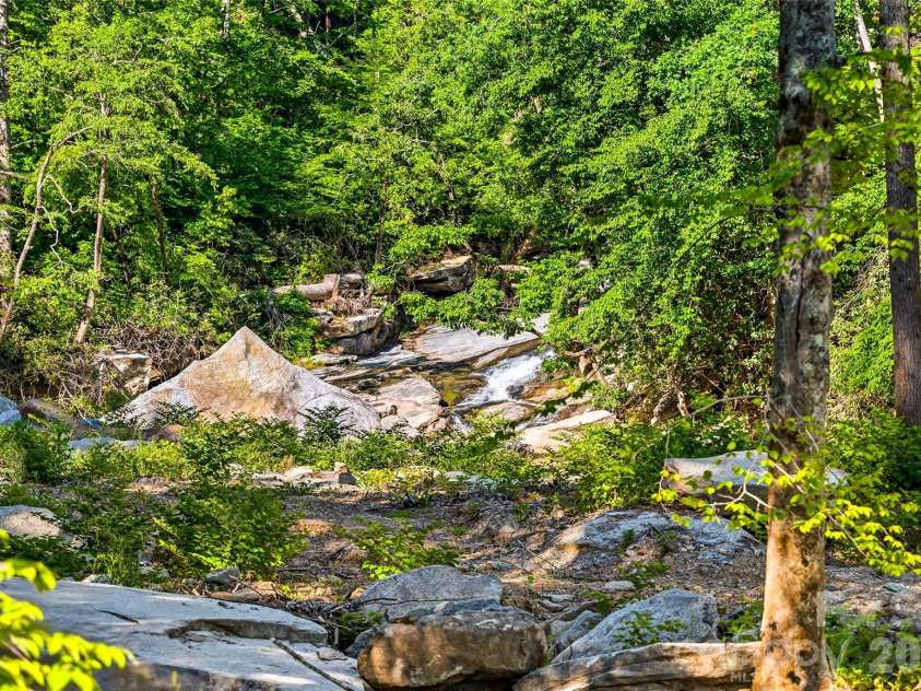 45 Alan Retreat Road, Hendersonville, NC 28792.  MLS# CAR4364735, YatesRealty ID 11110. Enjoy the sounds of the creek!