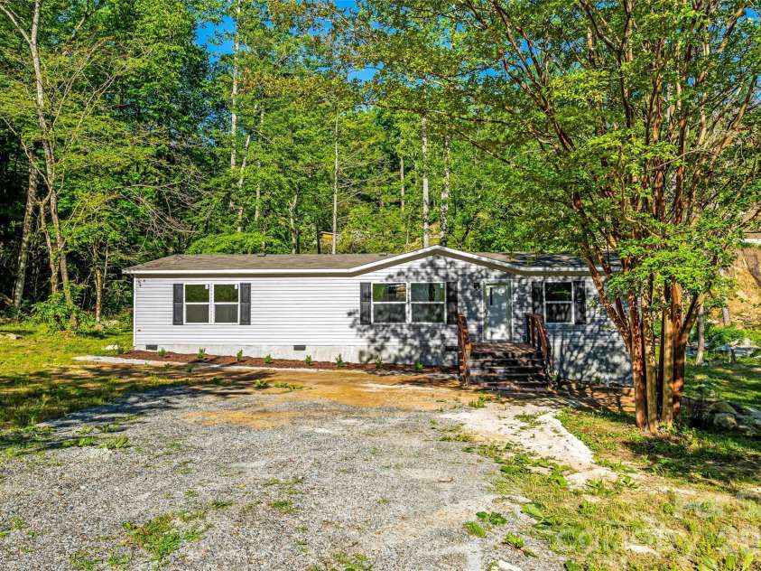 45 Alan Retreat Road, Hendersonville, NC 28792.  MLS# CAR4364735, YatesRealty ID 11110. Front exterior and parking area
