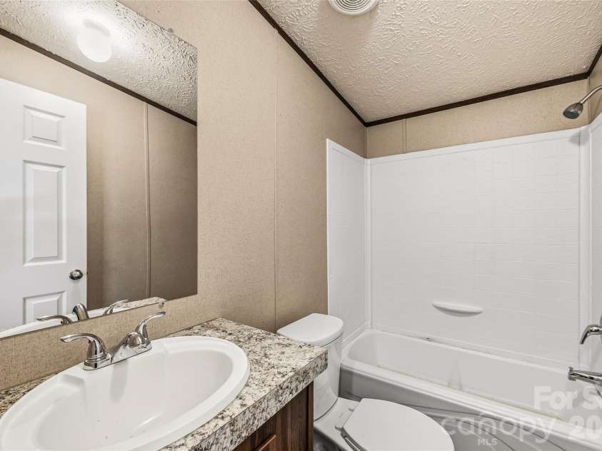 45 Alan Retreat Road, Hendersonville, NC 28792.  MLS# CAR4364735, YatesRealty ID 11110. Guest bathroom 