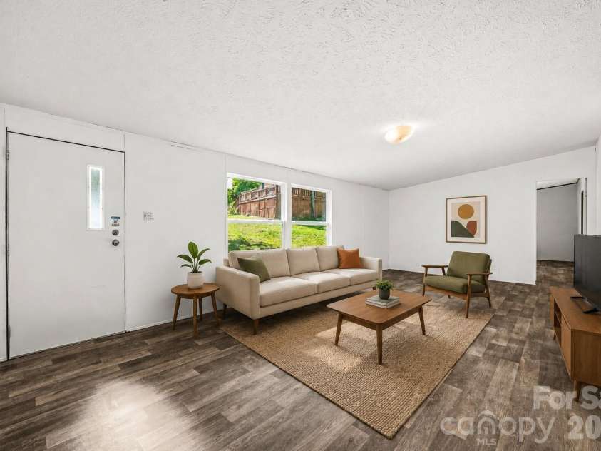 45 Alan Retreat Road, Hendersonville, NC 28792.  MLS# CAR4364735, YatesRealty ID 11110. Virtually staged living room
