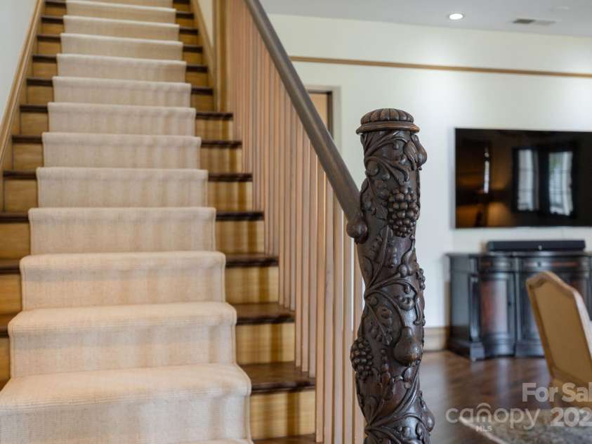 8 Fairway Place, Asheville, NC 28803.  MLS# CAR4245541, YatesRealty ID 11110. A hand-carved banister, where craftsmanship meets artistry.
