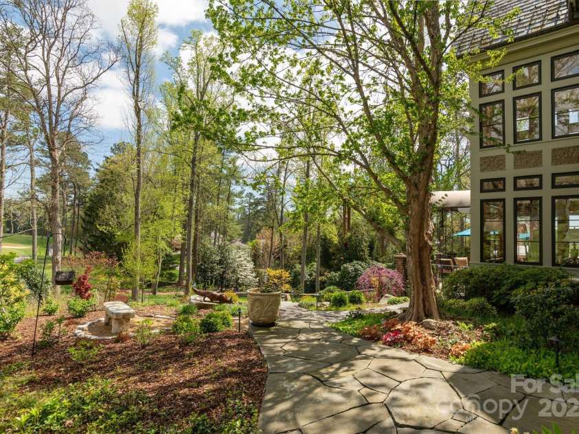 8 Fairway Place, Asheville, NC 28803.  MLS# CAR4245541, YatesRealty ID 11110. Beautiful stone walkways throughout the garden.