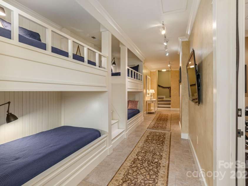 8 Fairway Place, Asheville, NC 28803.  MLS# CAR4245541, YatesRealty ID 11110. Custom-built bunk bed area. This multifunctional lower level balances utility with style.