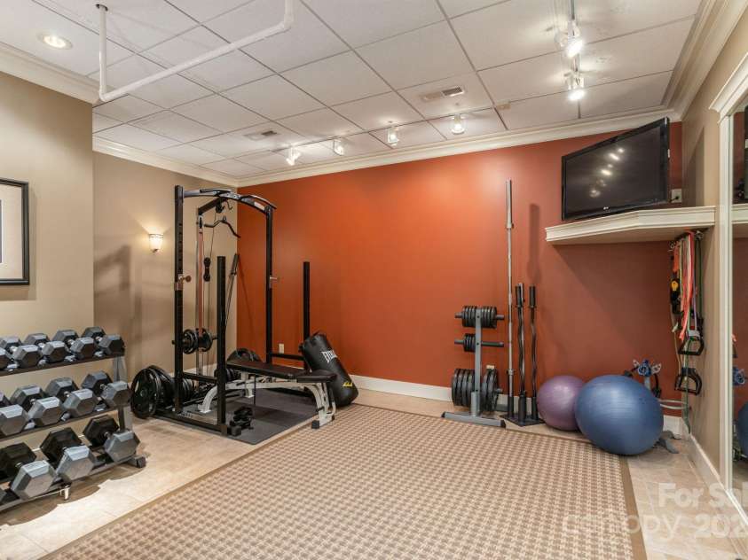 8 Fairway Place, Asheville, NC 28803.  MLS# CAR4245541, YatesRealty ID 11110. Fitness enthusiasts will appreciate the presence of a second workout room.