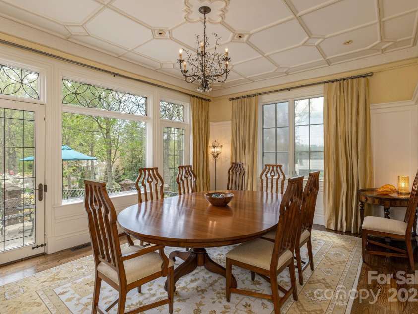 8 Fairway Place, Asheville, NC 28803.  MLS# CAR4245541, YatesRealty ID 11110. Formal Dining Room. Double doors open seamlessly to an expansive terrace, perfect for indoor-outdoor entertaining.