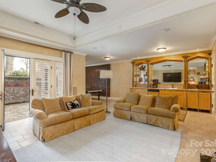 8 Fairway Place, Asheville, NC 28803.  MLS# CAR4245541, YatesRealty ID 11110. Large windows and French doors provide an exit to the outside, offering seamless indoor-outdoor living and easy access to the patio or backyard.