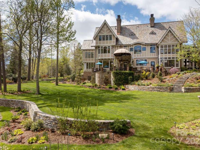 8 Fairway Place, Asheville, NC 28803.  MLS# CAR4245541, YatesRealty ID 11110. Nestled on a hill with easy slope of lawn.  Ideal for ourtdoor games.