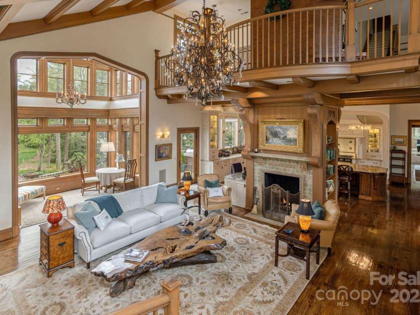 8 Fairway Place, Asheville, NC 28803.  MLS# CAR4245541, YatesRealty ID 11110. The family room opens onto a balcony that overlooks the great hall below, offering a stunning vantage point.