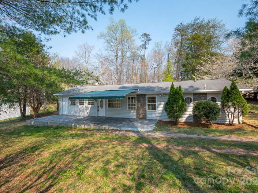 163 Woodland Drive, Columbus, NC 28722.  MLS# CAR4240701, YatesRealty ID 11111. Awning will automatically retract if it's too windy