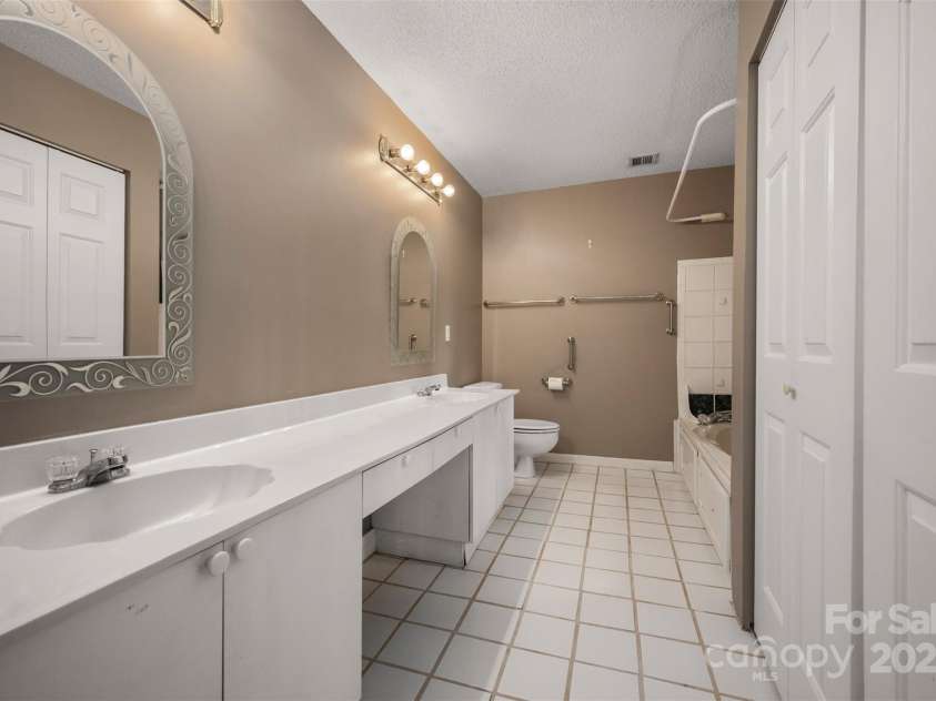 163 Woodland Drive, Columbus, NC 28722.  MLS# CAR4240701, YatesRealty ID 11111. Bathroom with tile floors and jet tub