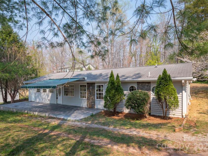 163 Woodland Drive, Columbus, NC 28722.  MLS# CAR4240701, YatesRealty ID 11111. Front patio with retractable awning