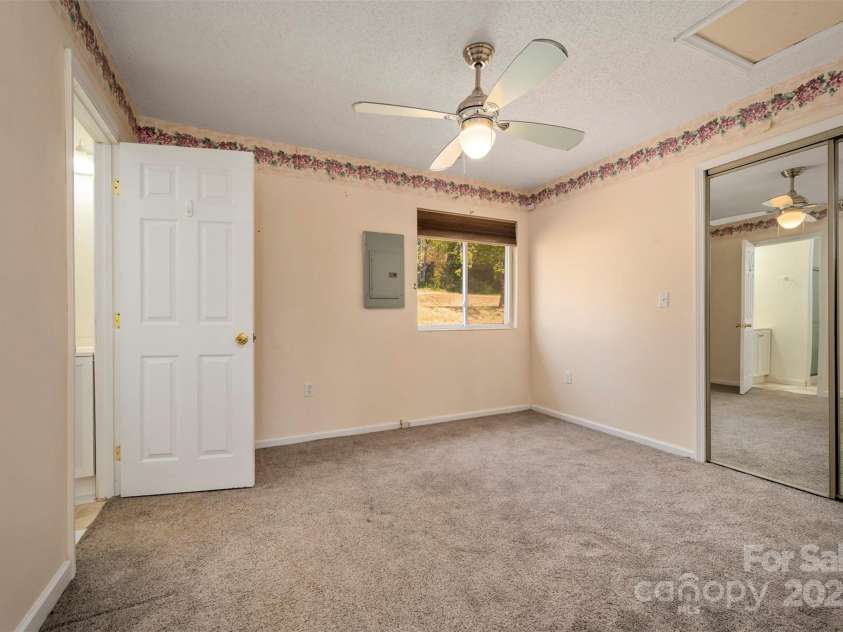 163 Woodland Drive, Columbus, NC 28722.  MLS# CAR4240701, YatesRealty ID 11111. Guest bedroom with en suite bathroom and walk-in closet