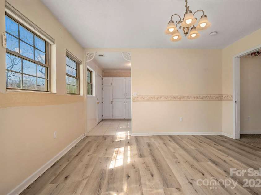 163 Woodland Drive, Columbus, NC 28722.  MLS# CAR4240701, YatesRealty ID 11111. Kitchen has it's own entry door.  A guest bedroom with en suite bathroom is on the right