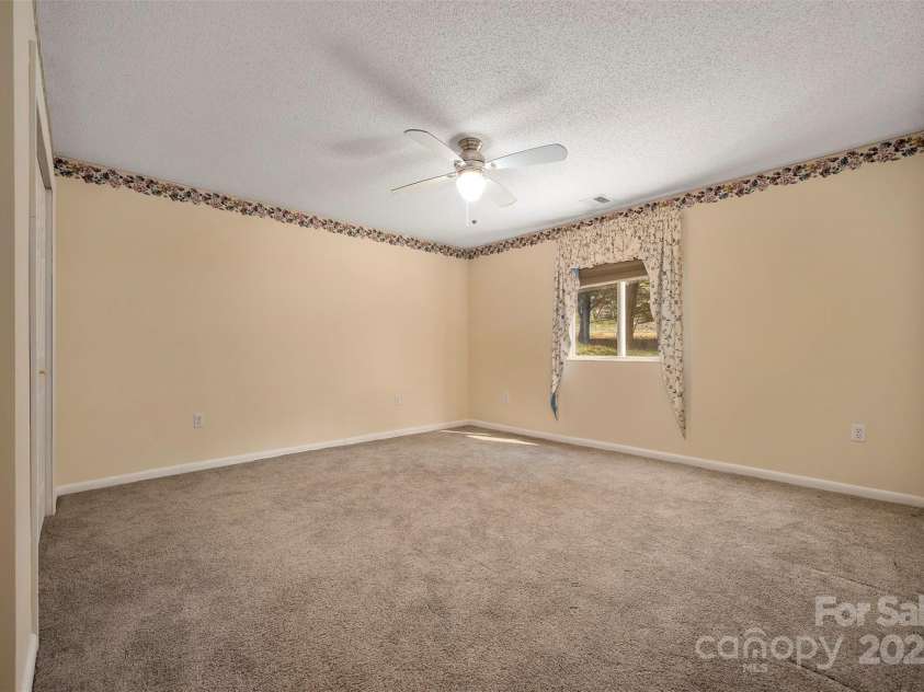 163 Woodland Drive, Columbus, NC 28722.  MLS# CAR4240701, YatesRealty ID 11111. Largest of the three bedrooms is at the back right side of the house